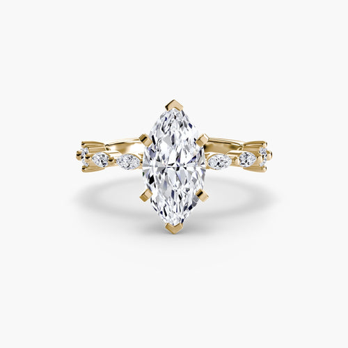 Gold ring with a marquise-shaped diamond on a white background